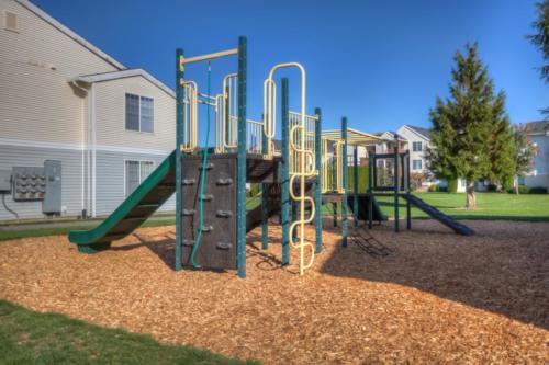 playground with apartments behind